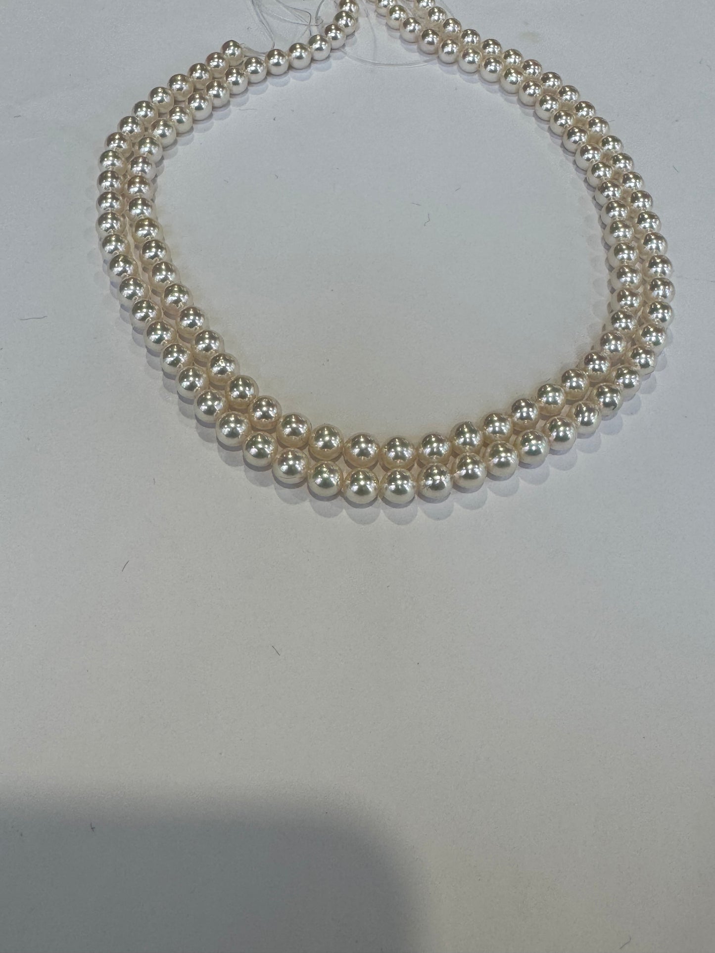 double strand 6 x 6 1/2 mm culture to call Pearls 14 karat gold clasp very high luster