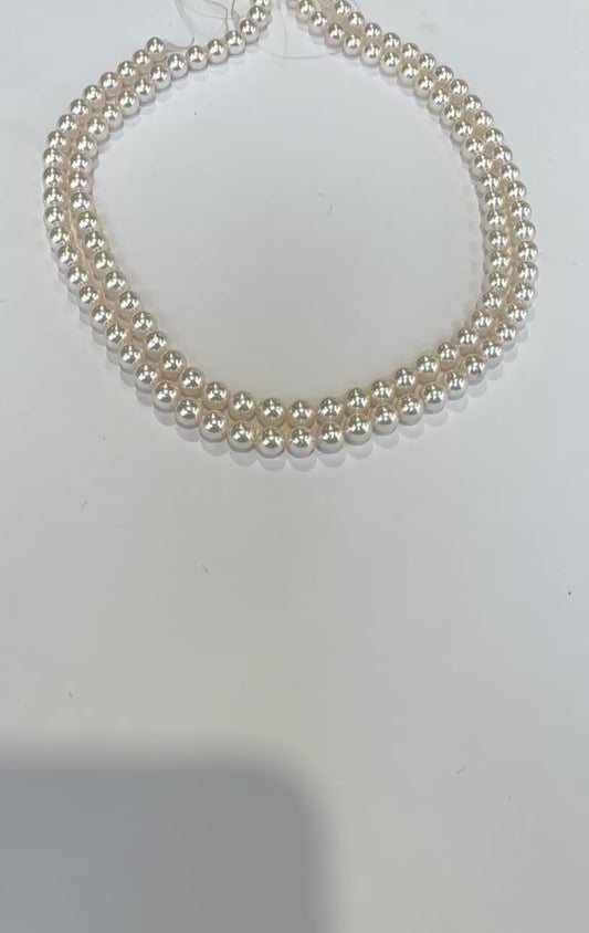 double strand 6 x 6 1/2 mm culture to call Pearls 14 karat gold clasp  very high luster