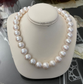 White freshwater pearl strand. 14k gold ball clasp